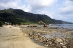 Digging up coral outside the Grand Lagoona Resort in Bangbao